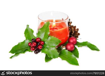 Christmas composition with burning candle and holly berries on a white background
