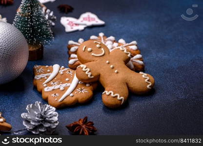 Christmas composition with gingerbread cookies, Christmas toys, pine cones and spices. Winter holidays background. Christmas composition with gingerbread cookies, Christmas toys, pine cones and spices