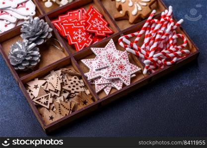 Christmas composition with gingerbread cookies, Christmas toys, pine cones and spices. Winter holidays background. Christmas composition with gingerbread cookies, Christmas toys, pine cones and spices