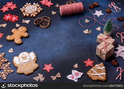 Christmas composition with gingerbread cookies, Christmas toys, pine cones and spices. Winter holidays background. Christmas composition with gingerbread cookies, Christmas toys, pine cones and spices