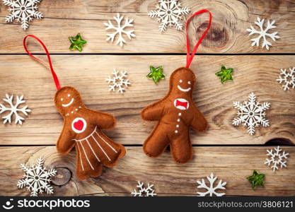 Christmas composition with gingerbread man and woman on wooden table. Top view