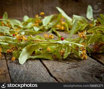 Christmas composition with linden blossom on old wooden table