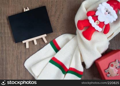 Christmas concept with winter and celebration items on wooden background