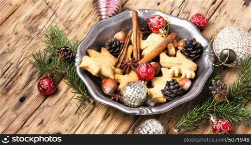 Christmas cookies and baubles. Retro tray with Christmas decorations and holiday cookies