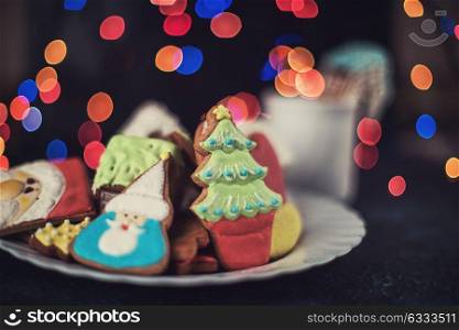 Christmas cookies and cup of tea. Christmas cookies and cup of tea on dark color bokeh lights background