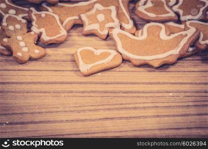 Christmas cookies in many shapes on a wooden background