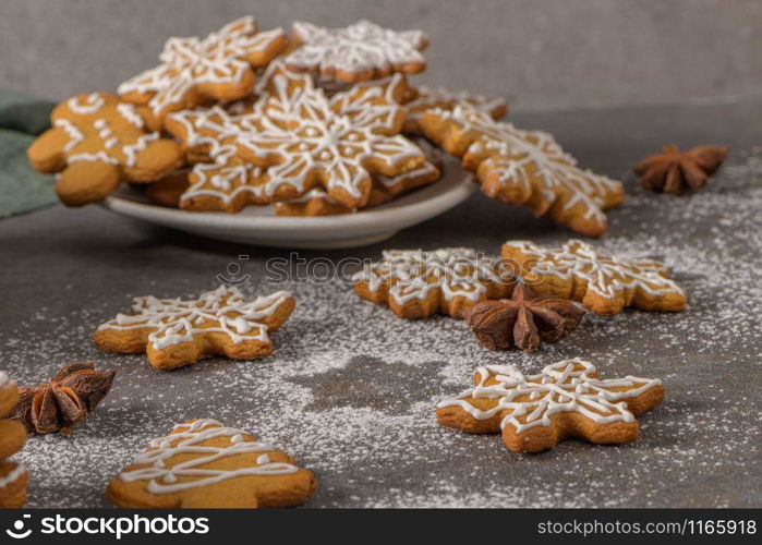 Christmas cookies on kitchen countertop with festive decorations.