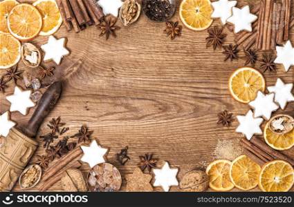 Christmas cookies, spices and baking ingredients. Holidays food background