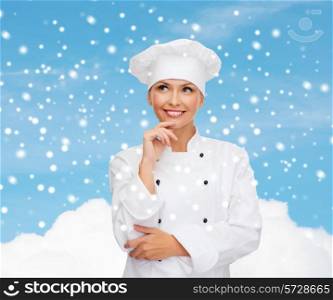 christmas, cooking, holidays and people concept - smiling female chef, cook or baker dreaming over sky and cloud background