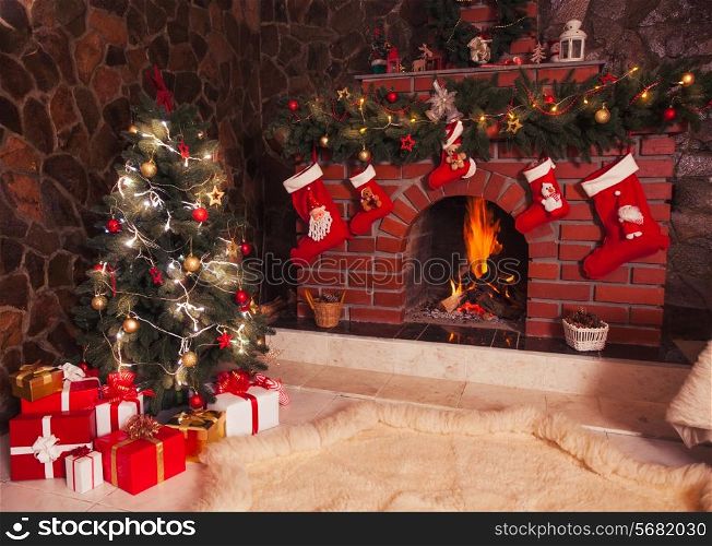 Christmas decorated fireplace and tree in the room