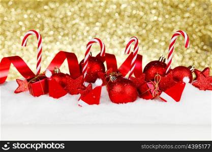 Christmas decoration and candies on snow