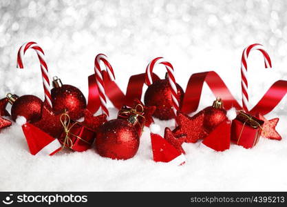 Christmas decoration and candies on snow