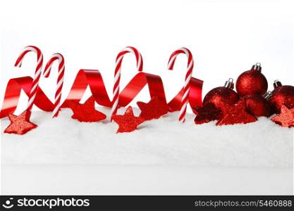 Christmas decoration and candies on snow