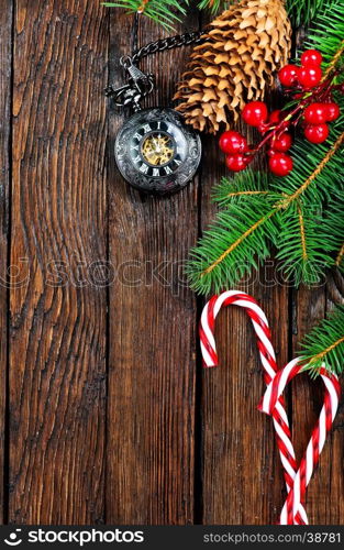 christmas decoration and fir on the wooden table