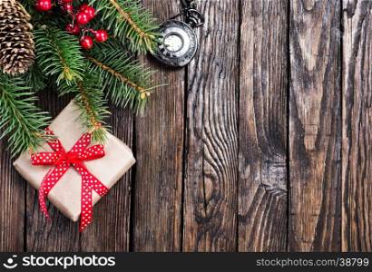 christmas decoration and fir on the wooden table