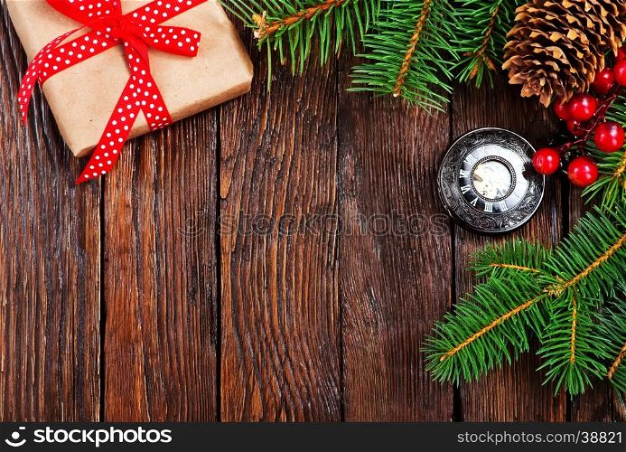 christmas decoration and fir on the wooden table