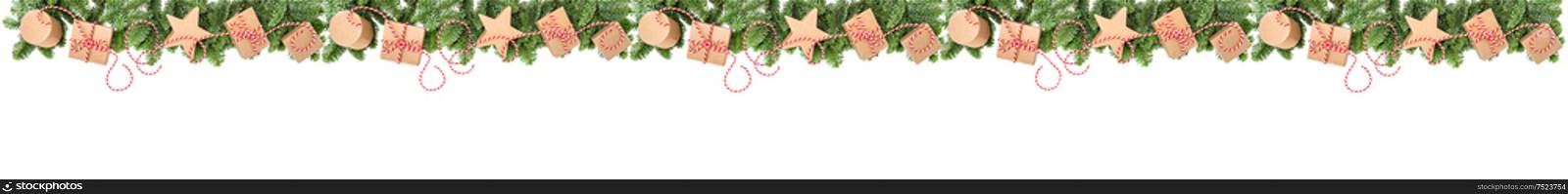 Christmas decoration and gift boxes. Pine tree branches border on white background. Holidays banner