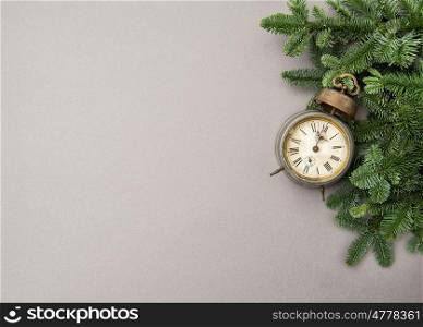 Christmas decoration antique golden clock on grey background
