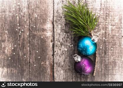 Christmas decoration ball on textured grungy wooden surface