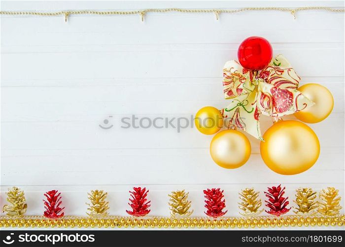 Christmas decoration balls and garland on a white background. Three colored balloons in a cap in the form of snowmen. Place for text. Christmas composition.. Christmas decoration balls and garland on a white background. Christmas composition.