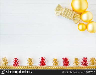 Christmas decoration balls and garland on a white background. Three colored balloons in a cap in the form of snowmen. Place for text. Christmas composition.. Christmas decoration balls and garland on a white background. Christmas composition.