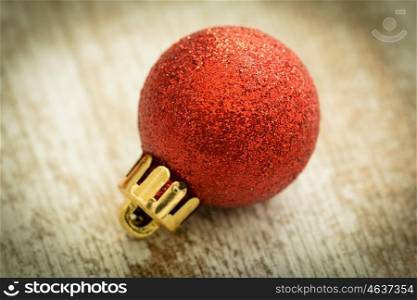Christmas decoration. Christmas ball on wooden background