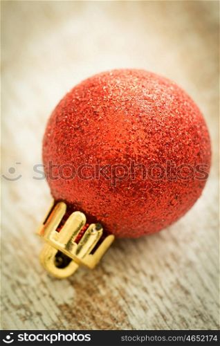 Christmas decoration. Christmas ball on wooden background