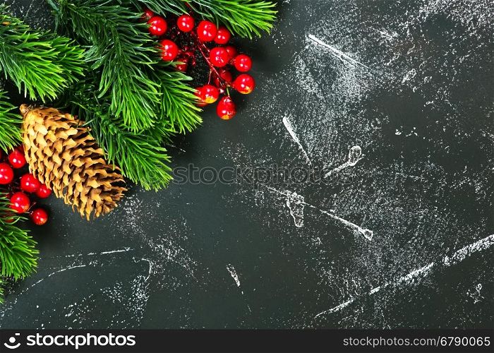 christmas decoration, cones and branch on a table