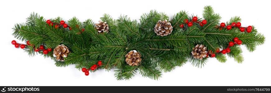 Christmas decoration design element of fir tree branches pine cones and red berries isolated on white background stripe border frame template. Christmas decoration on white