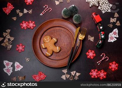 Christmas decoration e≤ments as well as gin≥rbread on a brown concrete background. Preparing a festive tab≤. Christmas decoration e≤ments as well as gin≥rbread on a brown concrete background