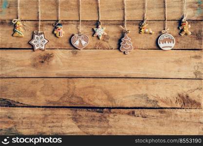 Christmas decoration hanging on wood background texture with copy space.