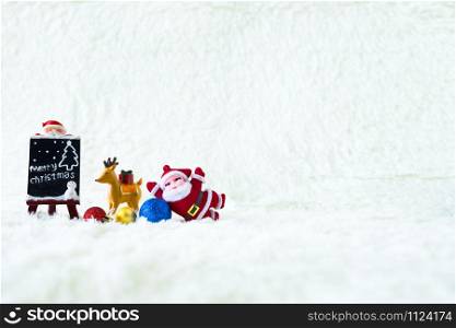 Christmas decoration Holiday with Santa Claus and snowman on snow background and copy space.