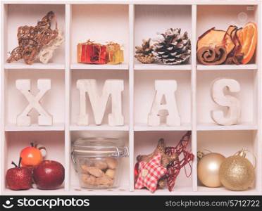 Christmas decoration in a wooden box. Cozy holiday in home. Wood letters XMAS in shadow box memories