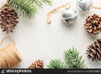 Christmas decoration  making a frame on a white wooden background. Christmas themes. Flat lay, copy space