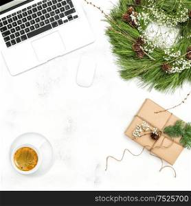 Christmas decoration office working place with coffee and gift. Flat lay