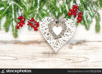 Christmas decoration on bright wooden background. Vintage style toned picture
