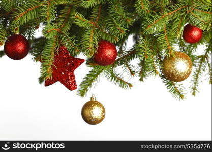Christmas decoration on fir branch isolated on white background