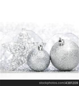 Christmas decoration on snow on shiny glitter background