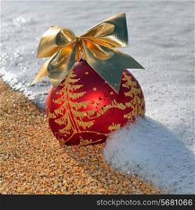 Christmas decoration on the beach against ocean wave