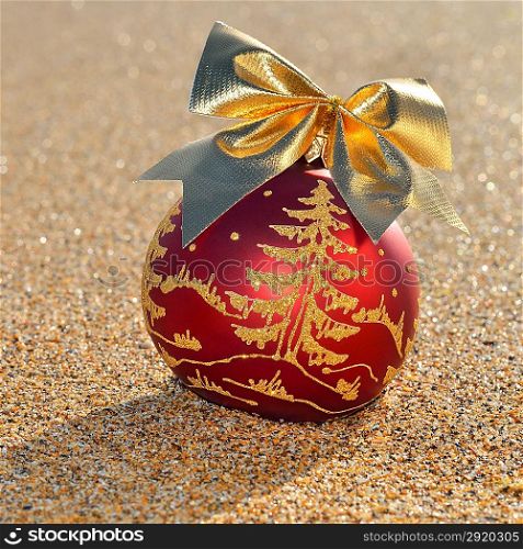 Christmas decoration on yellow sand