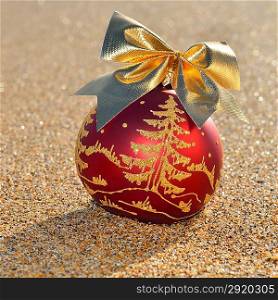 Christmas decoration on yellow sand