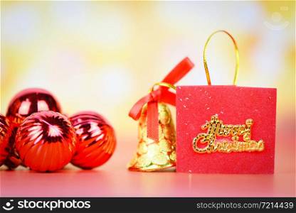 Christmas decoration red balls and bell with light gold abstract holiday background / christmas festive xmas winter and Happy New Year object concept