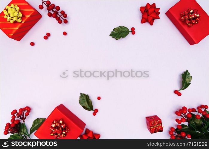 Christmas decoration. red gift box on purple background. Christmas, winter, new year concept. Flat lay, top view, copy space
