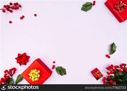 Christmas decoration. red gift box on purple background. Christmas, winter, new year concept. Flat lay, top view, copy space