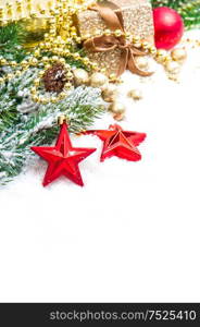 Christmas decoration red stars and golden ornaments on white background