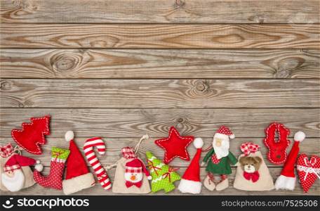 Christmas decoration textile toys on rustic wooden background