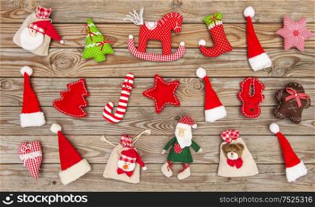 Christmas decoration toys and ornaments on rustic wooden background. Flat lay