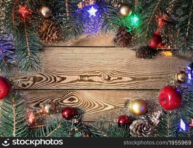 christmas decoration with lights on plank with copy space at the midle