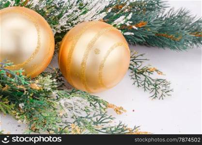 Christmas decoration with yellow balls and fir-tree branch.
