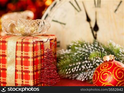 Christmas decorations against vintage clock at midnight. New year concept